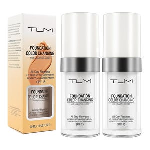 May include: The image displays TLM Foundation Color Changing products. There's a box and two bottles. The box is light orange with product information. The bottles are clear with white caps and silver bands. The text on the bottles and box reads "Foundation Color Changing".