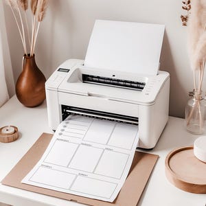 May include: A white printer printing a weekly planner sheet. The planner has sections for each day of the week. The printer sits on a white desk with decorative items, including a brown vase with dried plants.