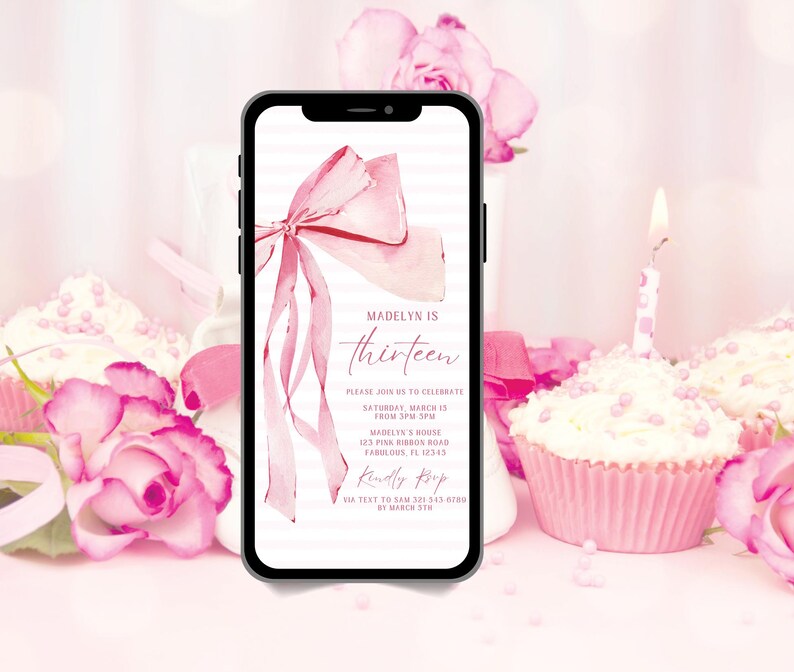 May include: A smartphone displays a pink birthday invitation with a watercolor bow and the text "Madelyn is thirteen." The invitation includes event details and a request to RSVP via text. Cupcakes and pink roses surround the phone.