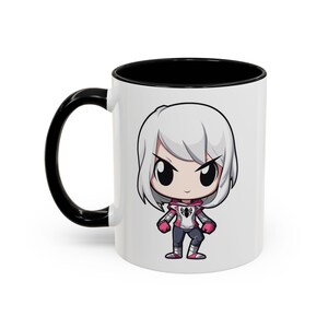 Left Side - Ceramic mug featuring Spider-Gwen in her iconic white and pink suit, complete with web accents and dynamic design, perfect for Marvel fans and Spider-Verse enthusiasts.