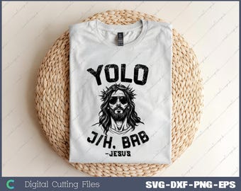May include: White t-shirt with a black graphic design featuring a man with a crown of thorns and sunglasses. The text "YOLO J/H. BAB -JESUS" is printed on the shirt.
