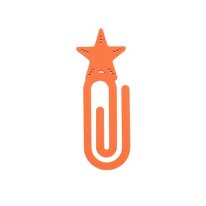 May include: Orange star-shaped bookmark with a paperclip design. The star has small circular cutouts and is connected to the paperclip portion. The bookmark is made of a solid orange material and is set against a white background.