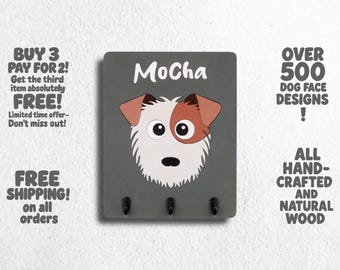 May include: A gray wooden key holder with the word "MoCha" and a cartoon dog face. The key holder has three hooks. The text "BUY 3 PAY FOR 2! Get the third item absolutely FREE! Limited time offer - Don't miss out!" is on the left side of the image. The text "OVER 500 DOG FACE DESIGNS! ALL HAND-CRAFTED AND NATURAL WOOD" is on the right side of the image.