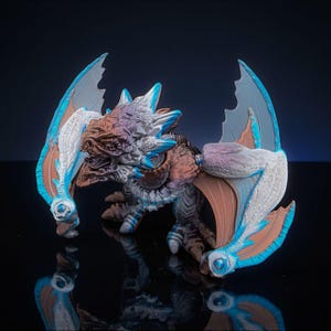 May include: A set of three ceramic mugs with a speckled, matte finish. Each mug features a different color: light blue, cream, and gray. The mugs have a simple, modern design and a comfortable handle.