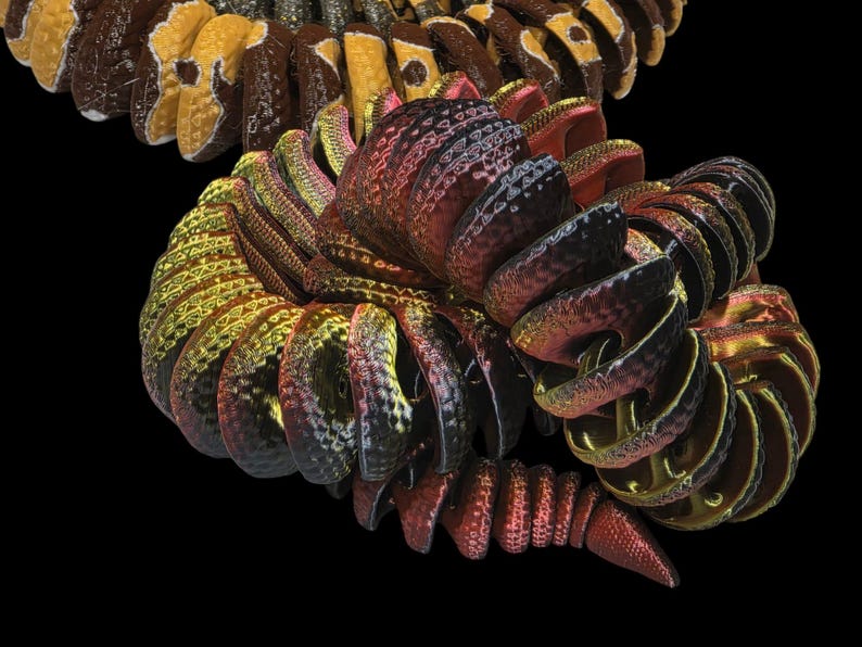 May include: Abstract digital art piece featuring a complex, spiraling form. The artwork showcases a blend of colors, including gold, red, and brown, with intricate details and textures. The design is set against a stark black background.