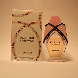 May include: A gold and white box with the text "Dresscode for Her" and "For Her Eau de Parfum" on it. The box is next to a clear glass bottle of perfume with a gold cap and the text "Dresscode for Her" and "For Her Eau de Parfum" on it.