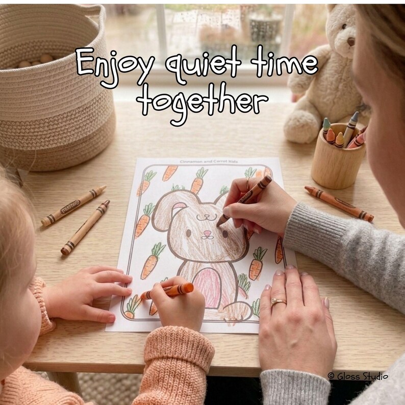 May include: A coloring page with a bunny and carrots is being colored with orange crayons. The text "Enjoy quiet time together" is above the coloring page. A basket and a teddy bear are in the background.