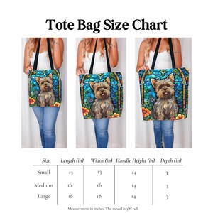 a woman holding a bag with a picture of a yorkshire terrier yorkie dog on it