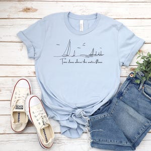 Time slows where the water flows I Nautical Gifts | Sailing T-Shirt | Ideal for Sailors, Boaters | Gifts For Boaters I Cruise Shirt