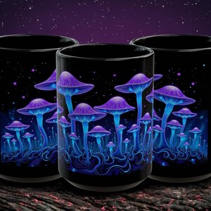 May include: Three black ceramic mugs with a vibrant illustration of glowing blue and purple mushrooms against a starry night sky. The design features detailed mushroom caps and stems, creating a whimsical and colorful aesthetic.