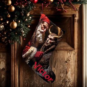 May include: A Christmas stocking featuring a detailed image of Santa Claus and a horned creature. The stocking is black with the name "Victor" in red script. The background includes a wooden door and Christmas decorations.