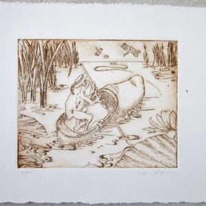 May include: A sepia-toned etching on textured paper depicts a figure in a boat on a pond, surrounded by reeds, lily pads, and a flying frog. The artwork has a rustic, handmade aesthetic, with delicate linework and a serene atmosphere.