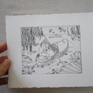 May include: Black and white etching print depicting a figure in a small boat fishing in a marshy area. Reeds and water lilies surround the boat. A dragonfly and other insects are also visible in the scene.