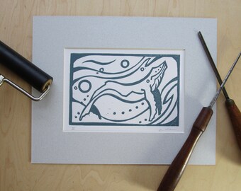 Linocut print of humpback whale