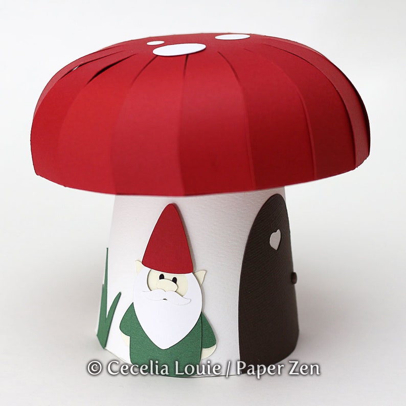 May include: A red and white mushroom shaped papercraft with a white door and a green gnome with a white beard and red hat.