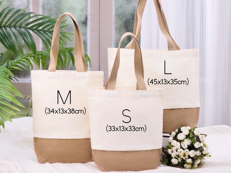 May include: Three canvas tote bags in varying sizes: S, M, and L. The bags have a natural beige color with a brown burlap bottom and matching handles. The S bag is 33x13x33cm, the M bag is 34x13x38cm, and the L bag is 45x13x35cm.