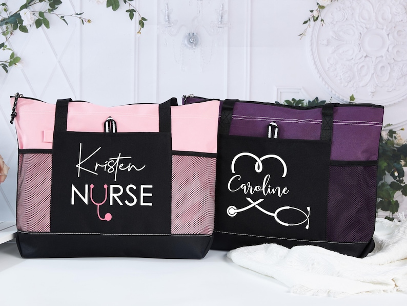 May include: Two personalized tote bags. One is pink and black with "Kristen Nurse" printed on the front, and a stethoscope graphic. The other is purple and black with "Caroline" and a stethoscope graphic.
