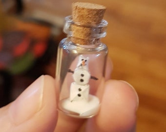 Pendant origami snowman in tiny glass bottle