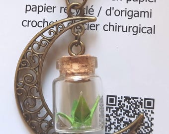 Miniature hand folded Japanese origami paper crane in mini jars dangling within bronze crescent moon necklace