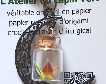Miniature hand folded Japanese origami paper crane in mini jars dangling within black crescent moon necklace