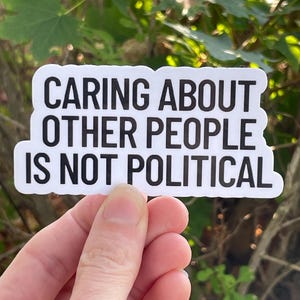Vinyl Sticker "Caring about other people is not political” Empathy Sticker, Progressive Sticker image 1