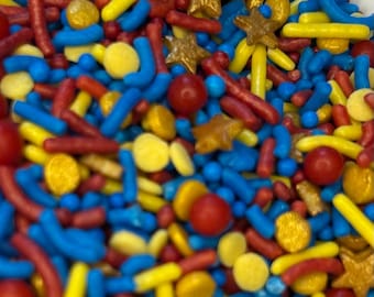 Super hero/ super dad sugar sprinkle mix.  Blue, red, yellow and gold sprinkles. Cookie, cupcake, cake, dipped Oreo, pretzel sprinkle decor.