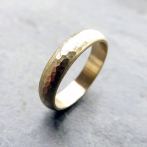 Rustic primitive matte finish 4mm heavily hammered 14k yellow gold domed wedding band.