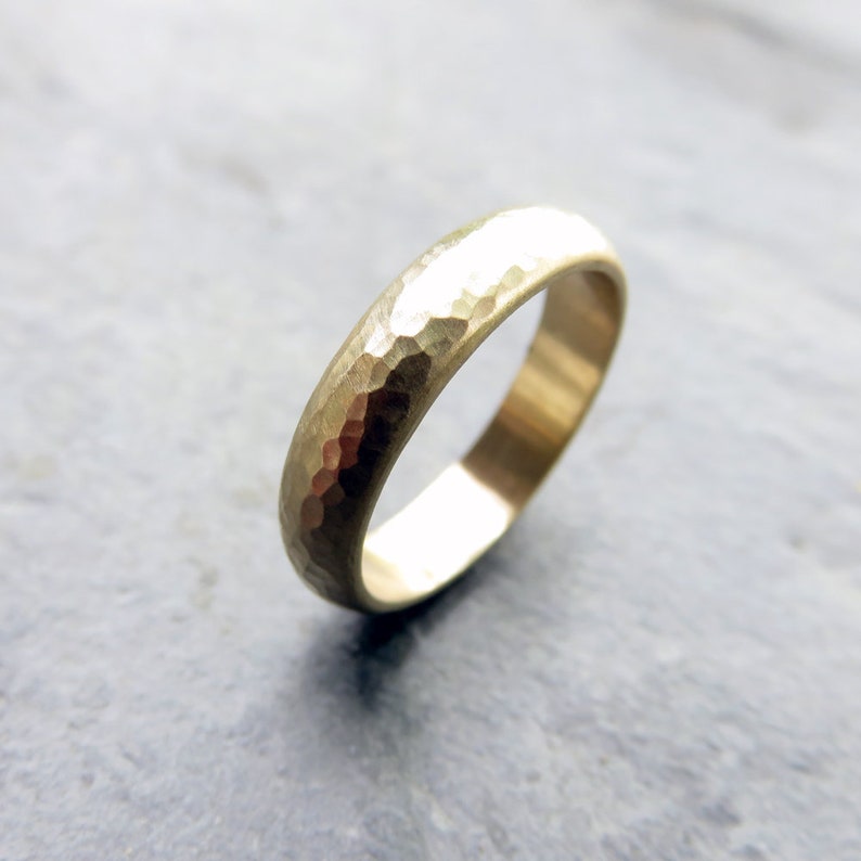 Rustic primitive matte finish 4mm heavily hammered 14k yellow gold domed wedding band.