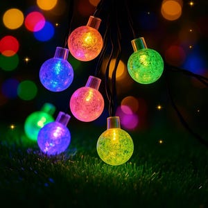 May include: String of colorful globe lights in shades of blue, green, pink, orange, and yellow. The lights are on black wires and are set against a background of blurred, colorful bokeh lights, creating a festive atmosphere.