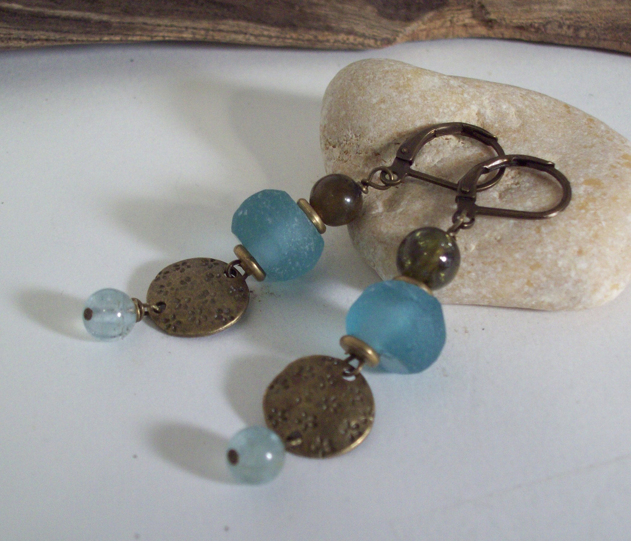 SEYCHELLES  EARRINGS– Blue African recycled powder glass beads with antique brass discs, aquamarine dangles with green peridot.