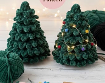 May include: Two handmade green crochet Christmas trees, one with string lights and colorful bulbs. The image includes yarn, a crochet hook, and a tag that says "Handmade with Love". Text on the image says "Crochet Pattern" and "Instant PDF Download".