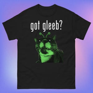 May include: Black t-shirt with a green alien cat wearing antennae and the text "got gleeb?" printed in white.