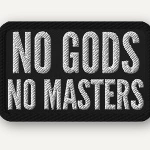 May include: Black rectangular patch with white embroidered text reading "NO GODS NO MASTERS". The patch has a black border and is likely designed to be sewn onto clothing or accessories.