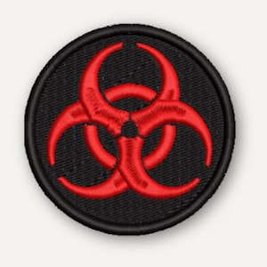 May include: A circular embroidered patch featuring a bright red biohazard symbol centred on a solid black background. The design is enclosed by a thick, black stitched border, creating a clean and defined edge for this circular textile emblem.
