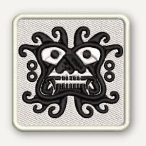May include: A square embroidered patch featuring a black stylized creature design with white eyes and teeth on a light gray textured background. The patch has a thick, light-colored border with rounded corners and a visible fabric weave texture.