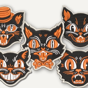 May include: Five embroidered patches featuring black cat faces with orange eyes and white accents. One cat wears an orange hat, one has an orange bow tie, and others show various expressions with visible teeth, all outlined in a cream-coloured border.