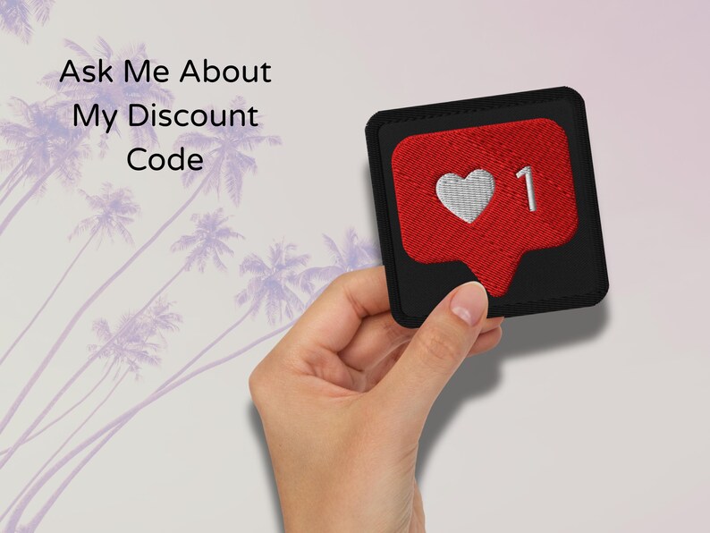 Flat lay of Micro Influencer patch iron-on with red Instagram heart icon, 1 Like text, on neutral background, showing crisp embroidery and playful self-deprecating humor, perfect for jackets, backpacks, or gifts.