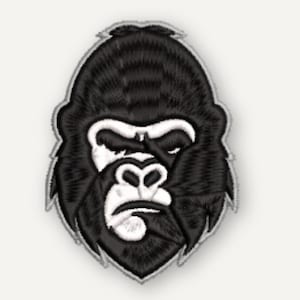 May include: An embroidered patch featuring the head of a gorilla. The design uses black thread for the fur and facial features, with white thread highlighting the eyes, nose, and mouth area. The patch has a distinct gray border outlining the shape.