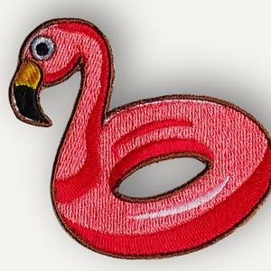 May include: A set of three ceramic nesting bowls in shades of blue, green, and white. The bowls feature a speckled glaze and a simple, modern design. The largest bowl is approximately 7 inches in diameter.