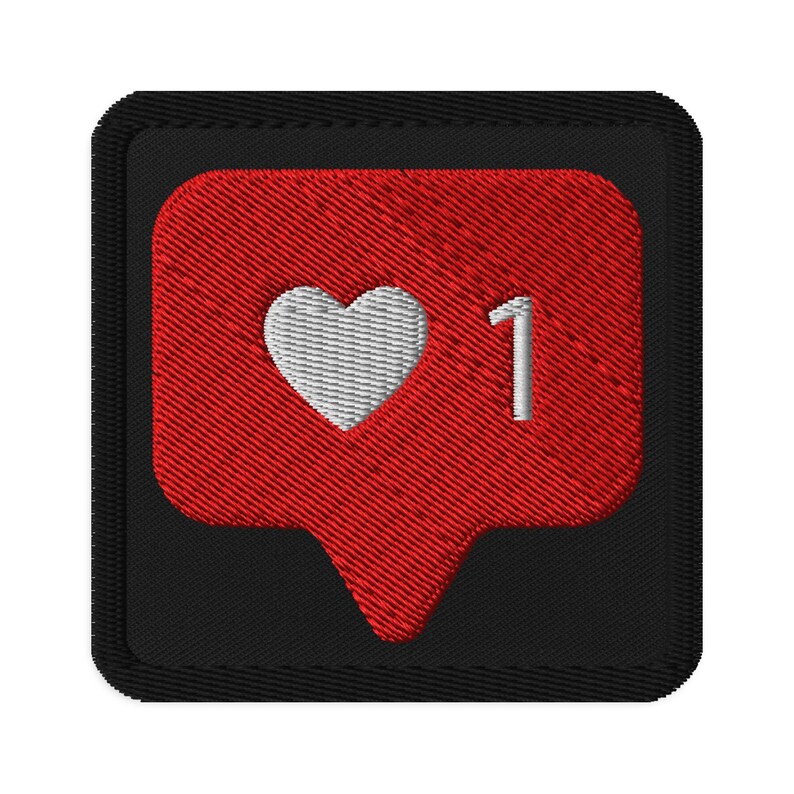 Embroidered patchesFlat lay of Micro Influencer patch iron-on with red Instagram heart icon, 1 Like text, on neutral background, showing crisp embroidery and playful self-deprecating humor, perfect for jackets, backpacks, or gifts.