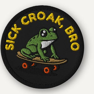 May include: Embroidered patch featuring a green frog on a skateboard with orange wheels. The patch is round and black, with the words "SICK CROAK, BRO" in yellow, arched around the frog.