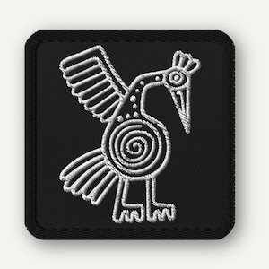 May include: Embroidered patch featuring a stylized white bird design on a black square. The bird has outstretched wings, a long beak, and a spiral detail on its body. The patch has a black border and is likely for clothing or accessories.