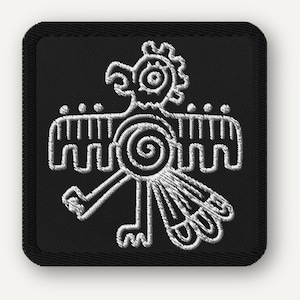 May include: Square black patch with a white embroidered design of a stylized bird or mythical creature. The design features a detailed head, wings, and a central spiral element. The patch has a black border.