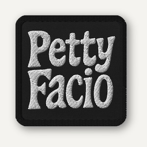 May include: Embroidered patch with the words "Petty Facio" in white, stylized, bubble letters. The patch is square with rounded corners and a black background. The lettering has a textured, stitched appearance.