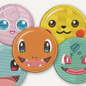 May include: A set of five circular embroidered patches featuring stylized character faces. The patches include a pink, yellow, orange, light blue, and mint green design, each with detailed stitching of eyes, mouths, and distinct facial features.