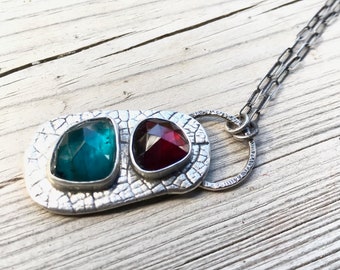 Two stone necklace with garnet and kyanite, sterling silver pendant with leaf texture