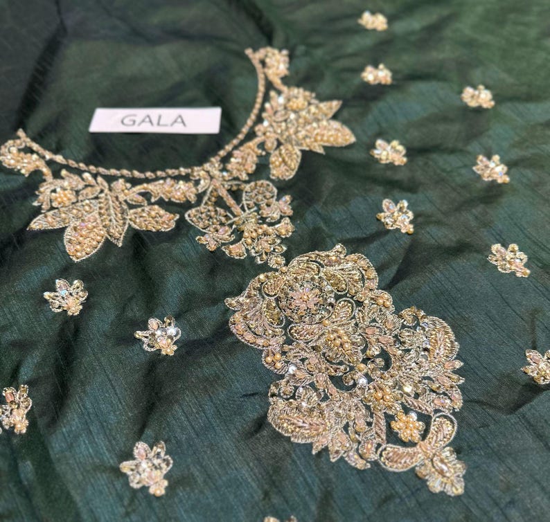 Close-up of intricate embroidery on green sharara suit – ideal Mehndi dress for bride
