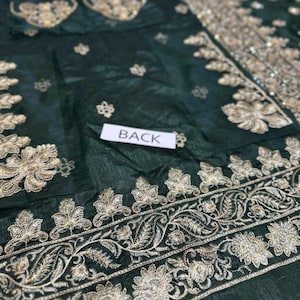 Back view of embroidered green Dulhan dress – traditional Pakistani wedding wear