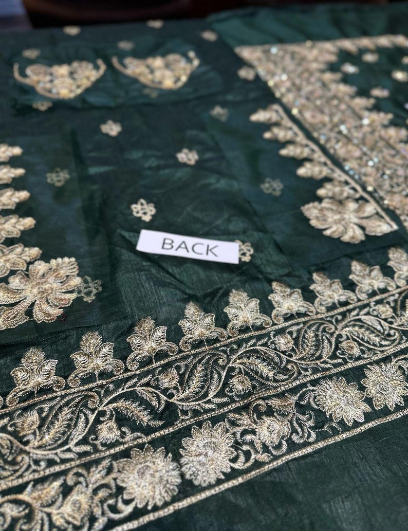 Back view of embroidered green Dulhan dress – traditional Pakistani wedding wear