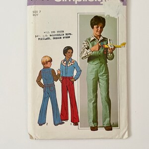 May include: Vintage Simplicity sewing pattern 7780 for boys' clothing, size 7. The pattern features illustrations of three different outfits: denim overalls, a button-up shirt with red pants, and a green vest and pants set. The pattern includes the text "WILL END STORE" and "PORTLAND, OREGON 97202".